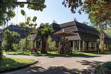 One of the very nice and well-maintained buildings housing the Teak exhibition Rai Mae Fah Luang, Chiang Rai, Thailand